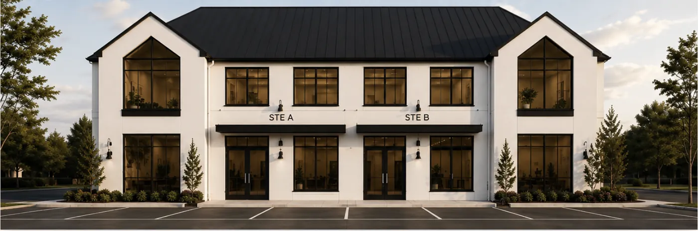 Front elevation of a white stucco two-story office villa with a black standing-seam gable roof, showing Suite A and Suite B entries
